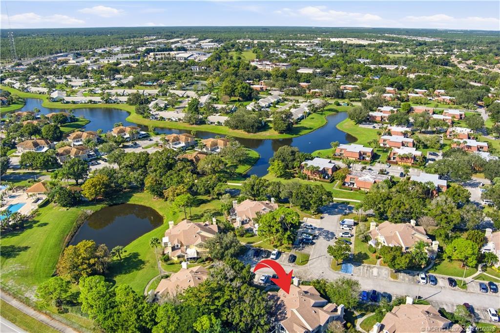 3584 Southwest Sunset Trace Circle Palm City, FL 34990 - Photo 30 of 32 an aerial view of residential houses with outdoor space