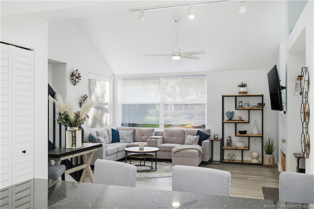 3584 Southwest Sunset Trace Circle Palm City, FL 34990 - Photo 6 of 32 a living room with furniture and a large window