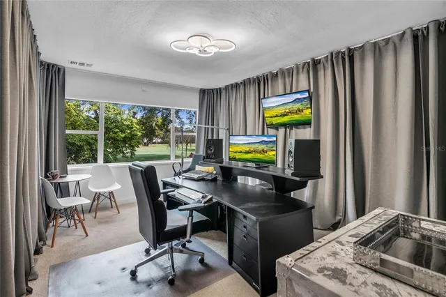 a work room with furniture and a window