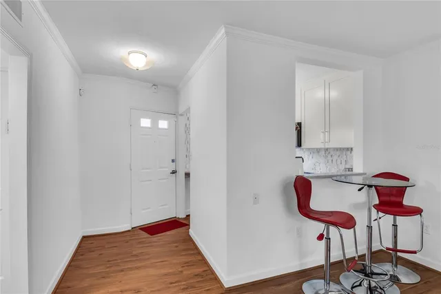a view of room with furniture and wooden floor