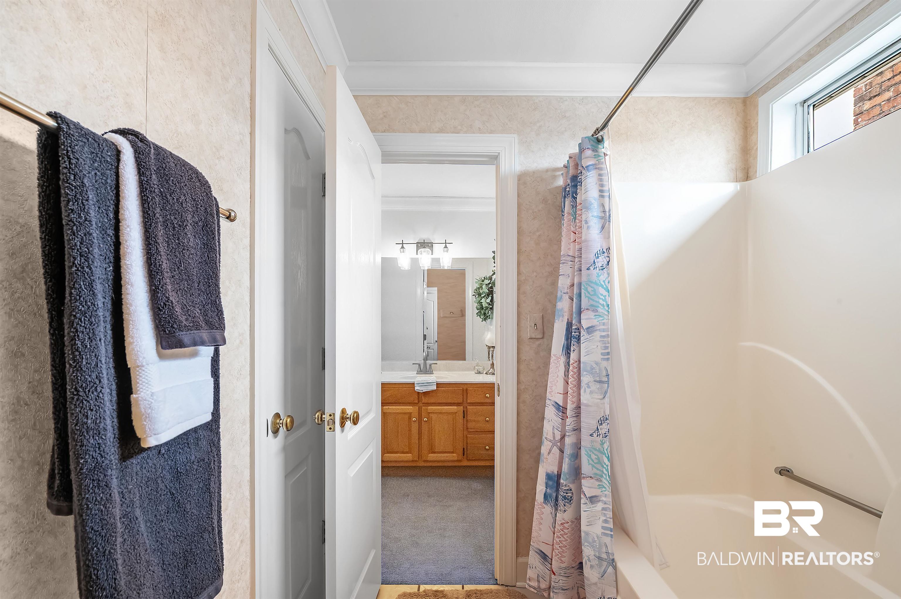 8915 Bay Point Drive Elberta, AL 36530 - Photo 70 of 74 Full bath featuring crown molding, vanity, and shower / bath combo with shower curtain