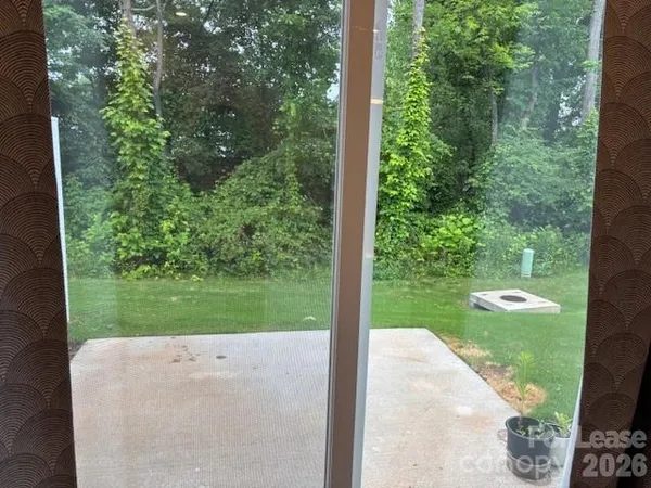 a view of a garden and trees