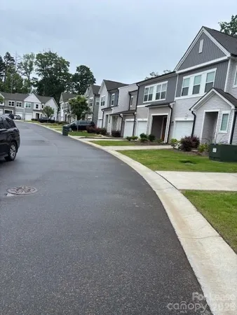 a view of multiple houses with a yard