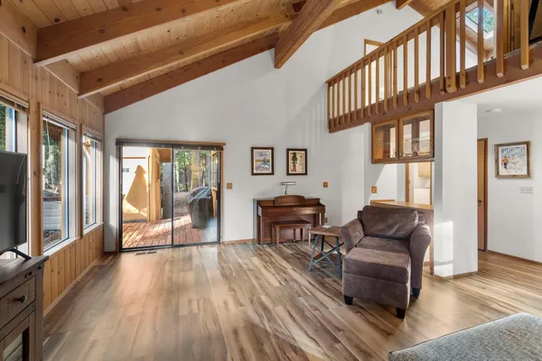 a view of a livingroom with furniture window and wooden floor