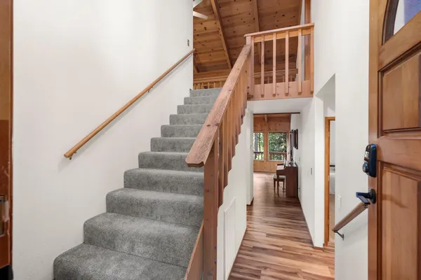 a view of a hallway with stairs