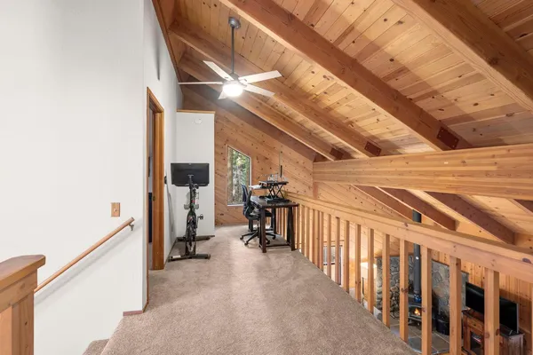 a view of a hallway with stairs