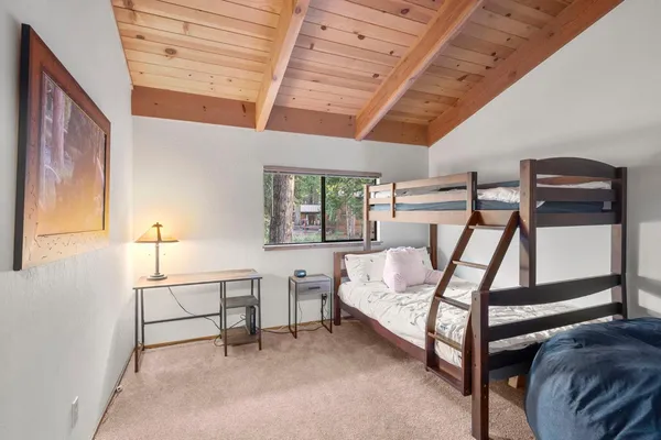 a view of a bedroom with furniture and staircase