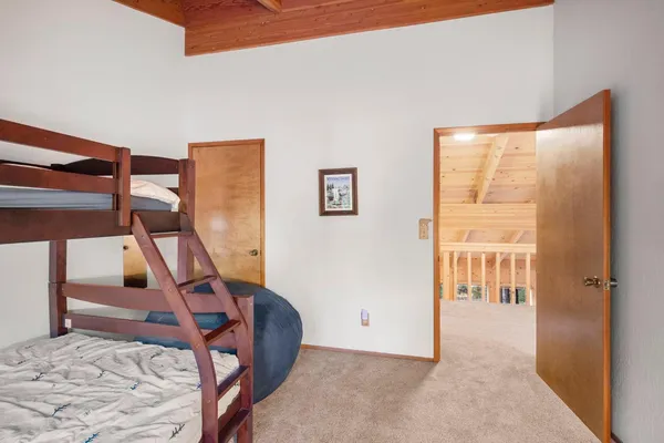 a bathroom with a bathtub sink vanity and mirror