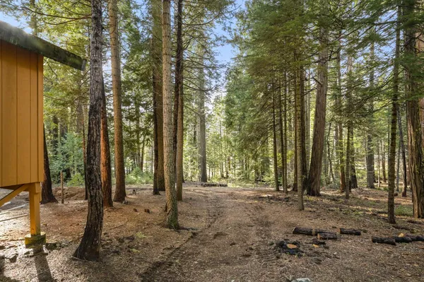 a view of balcony with wooden floor and fence