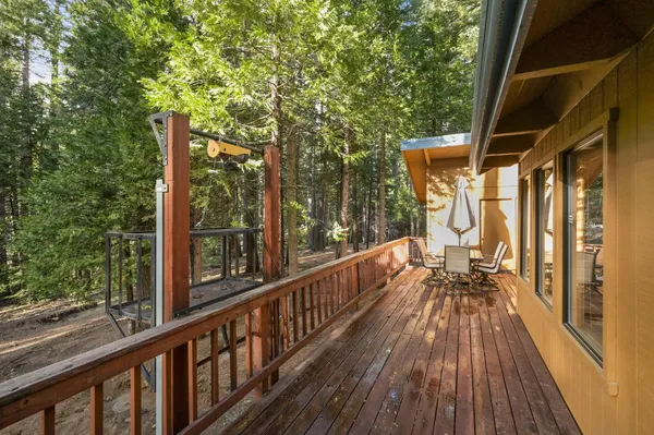 a view of a house with a large window and wooden floor