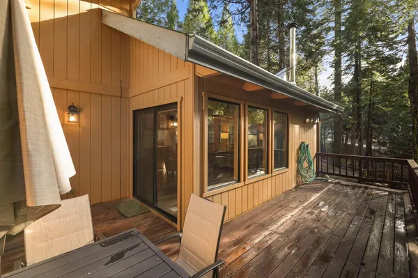a view of deck with furniture and barbeque oven