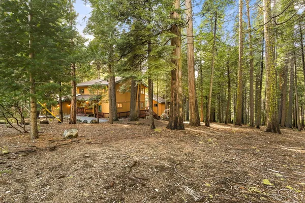 a view of a house with a porch and furniture