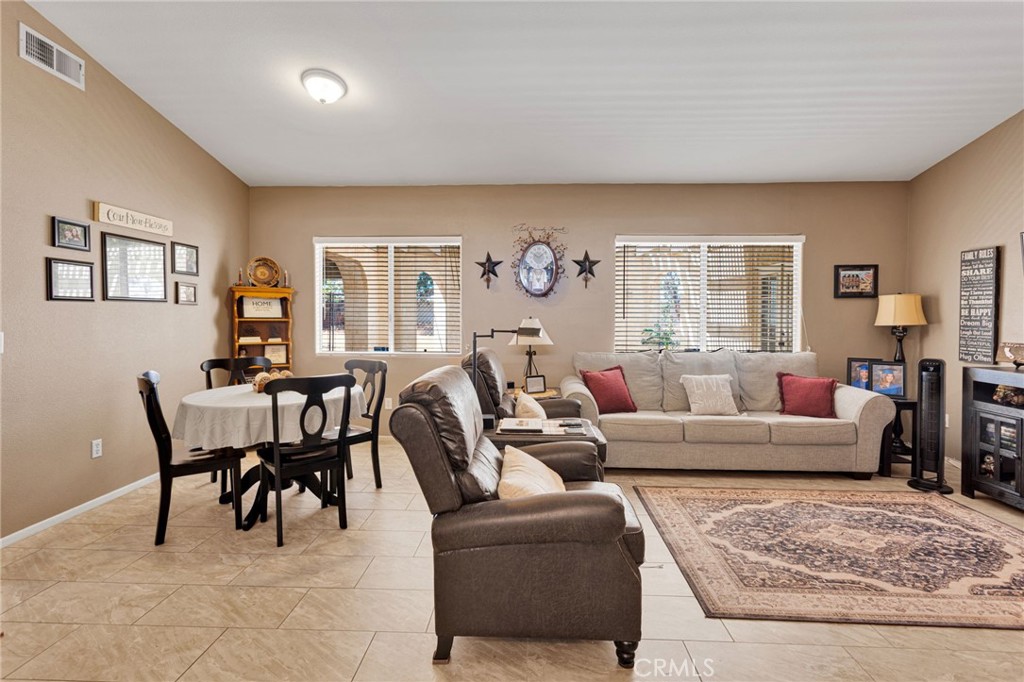 20403 Ochoa Road Apple Valley, CA 92307 - Photo 17 of 48 a living room with furniture dining table and a window