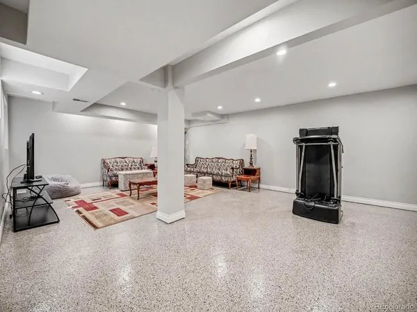 a room with gym equipment and a mirror