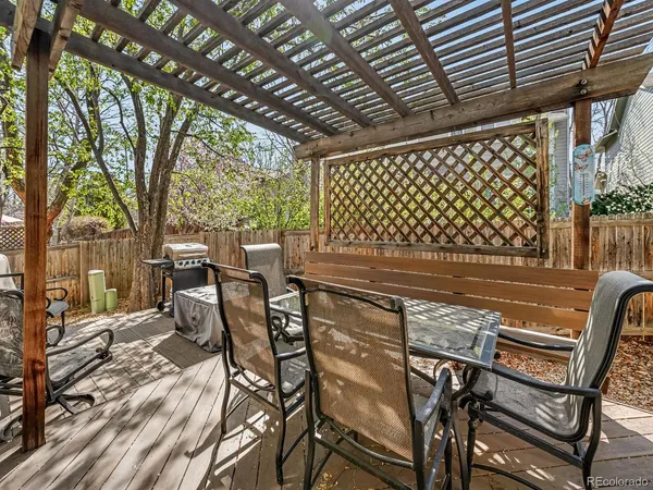 a patio with table and chairs
