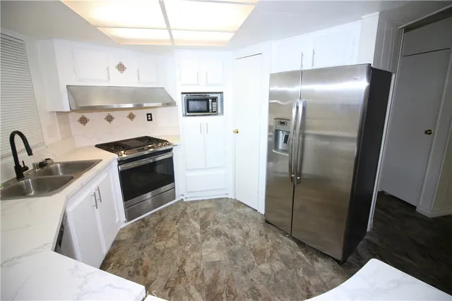 a bathroom with a sink and mirror