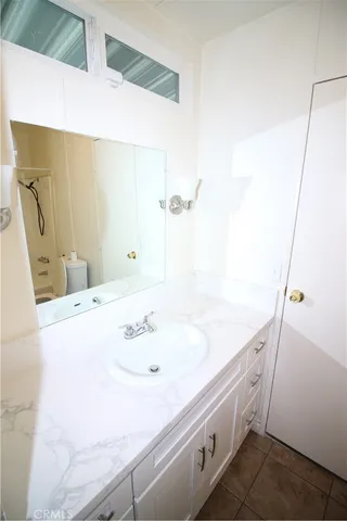 a bathroom with a toilet and a bathtub