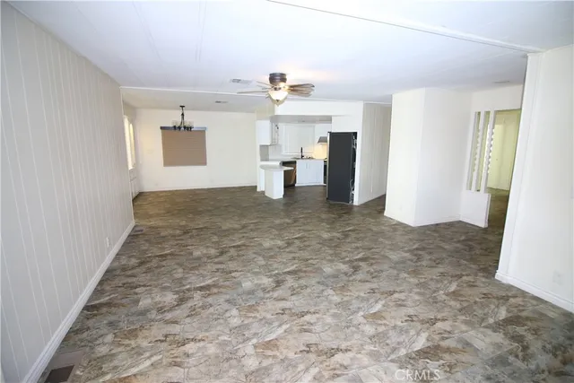 a view of a kitchen with a sink and dishwasher and kitchen view