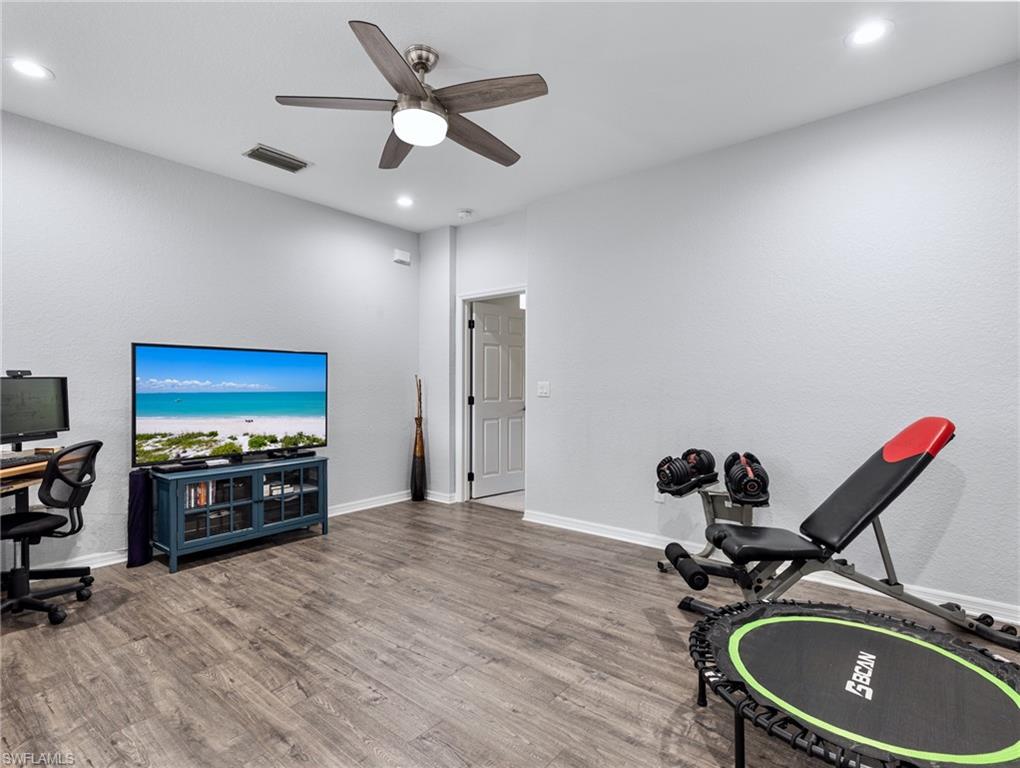 20334 Larino Loop Estero, FL 33928 - Photo 23 of 39 a very nice looking room with a wooden floor