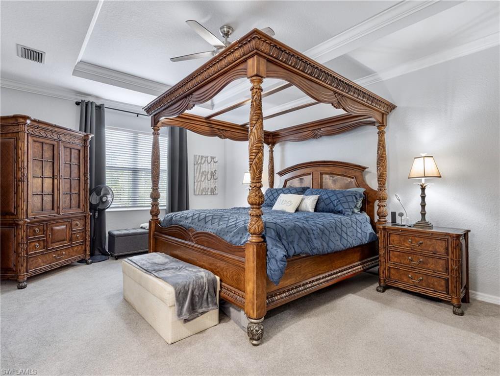 20334 Larino Loop Estero, FL 33928 - Photo 25 of 39 a bedroom with a bed lamp and a dresser