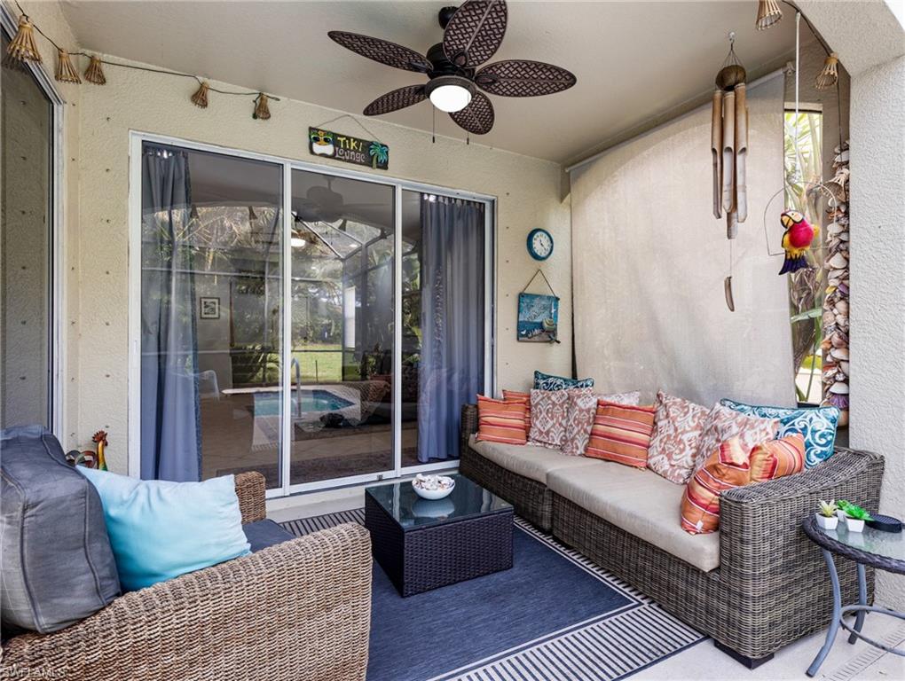 20334 Larino Loop Estero, FL 33928 - Photo 37 of 39 a living room with furniture ceiling fan and a rug