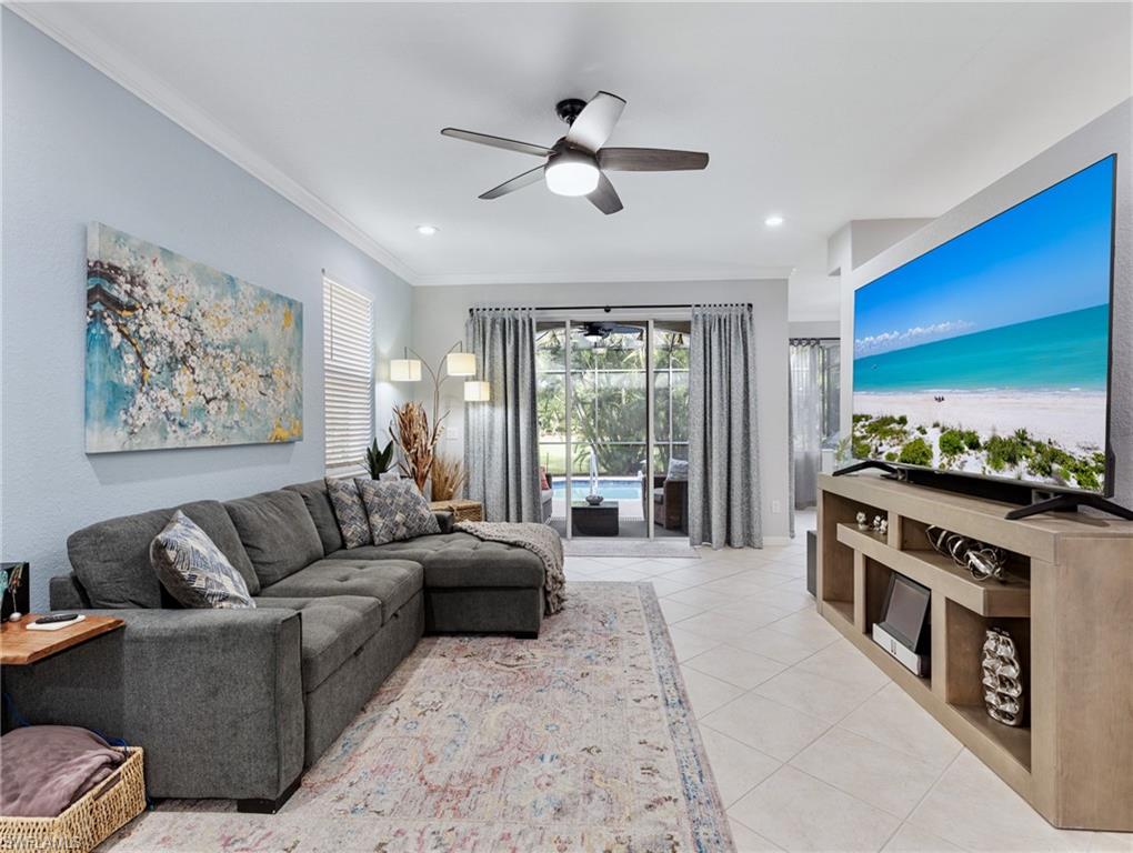 20334 Larino Loop Estero, FL 33928 - Photo 5 of 39 a living room with furniture and a flat screen tv