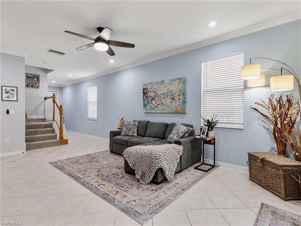 20334 Larino Loop Estero, FL 33928 - Photo 6 of 39 a living room with furniture and a lamp