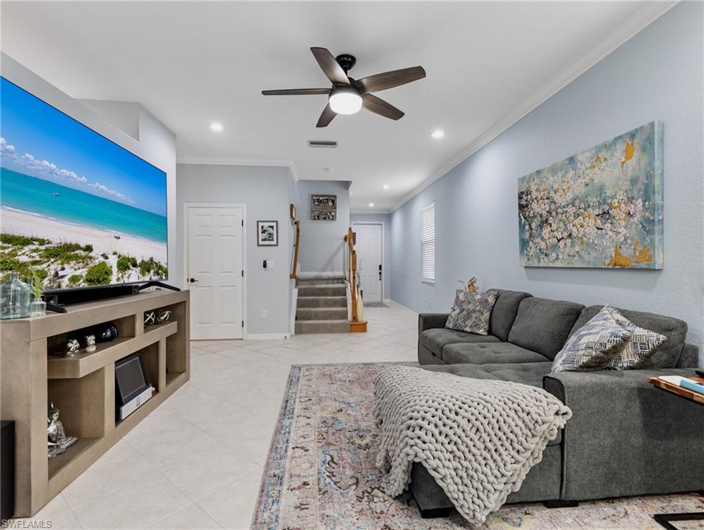 20334 Larino Loop Estero, FL 33928 - Photo 7 of 39 a living room with furniture and a flat screen tv
