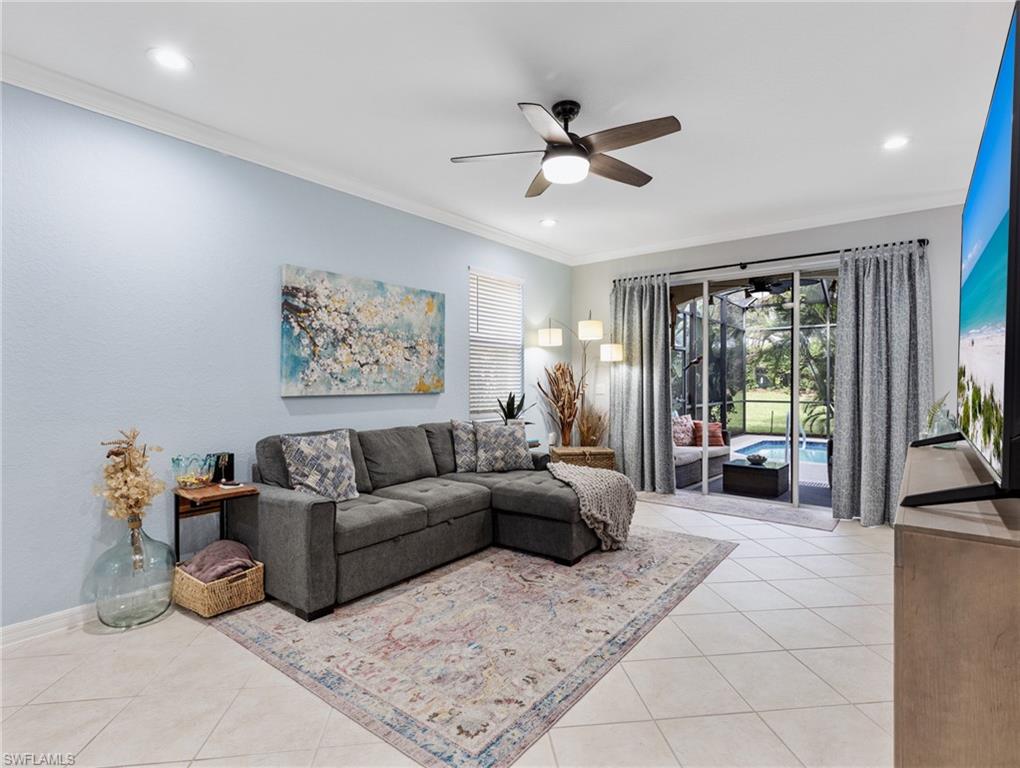 20334 Larino Loop Estero, FL 33928 - Photo 9 of 39 a living room with furniture and a large window