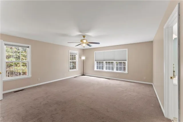 a spacious bathroom with a double vanity sink shower and a mirror