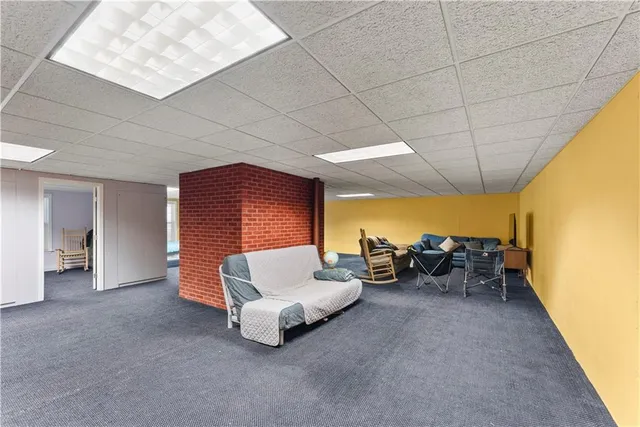 a dining room with a wooden table and chairs