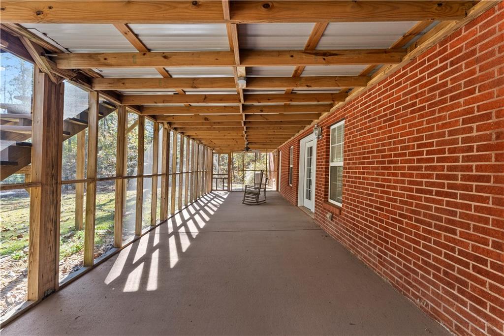 5478 Flakes Mill Road Ellenwood, GA 30294 - Photo 22 of 30 a view of a porch with wooden floor