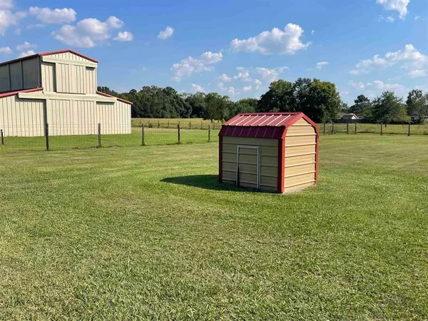 a view of a garden with an outdoor space