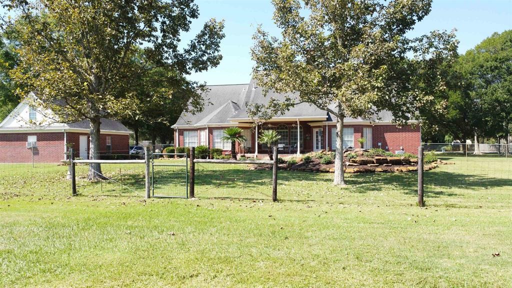1655 Wooten Road Beaumont, TX 77707 - Photo 37 of 46 a view of house with a backyard