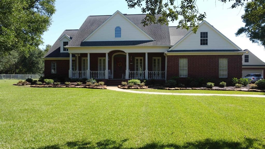 1655 Wooten Road Beaumont, TX 77707 - Photo 42 of 46 a view of a house with swimming pool and yard