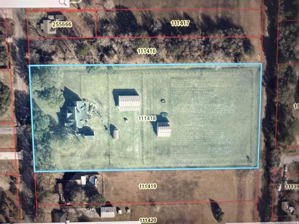1655 Wooten Road Beaumont, TX 77707 - Photo 45 of 46 an aerial view of a house with a yard