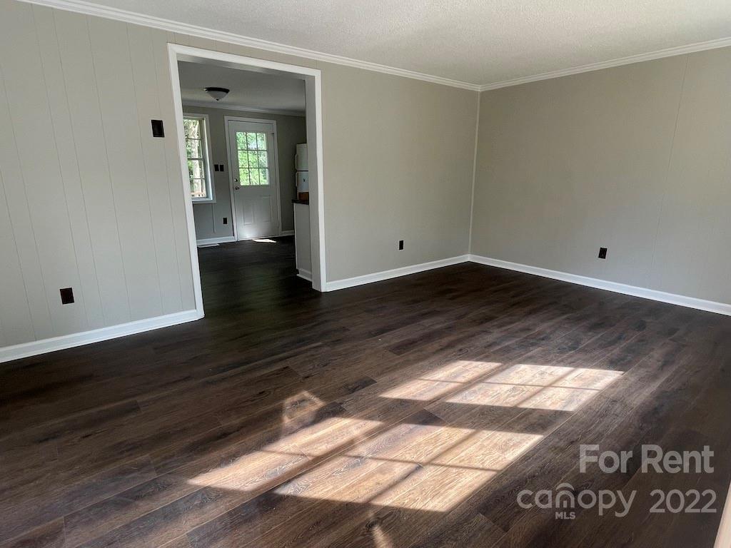 56 Barbee Road Southwest, Unit 1A Concord, NC 28027 - Photo 3 of 9 a view of a hallway with wooden floor