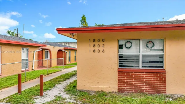 a front view of a house with a porch