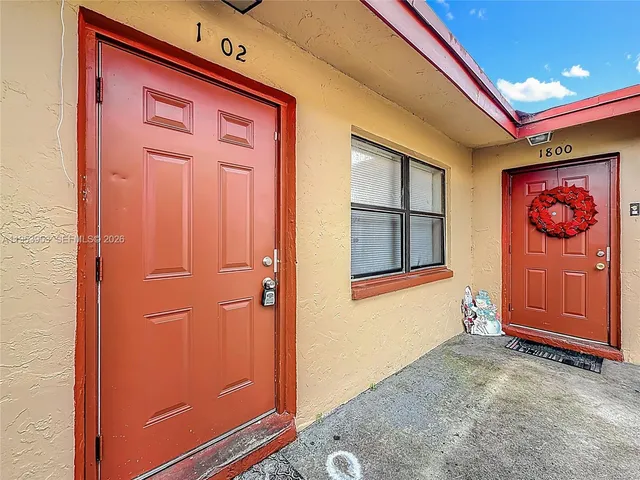 a view of kitchen with furniture and wooden floor