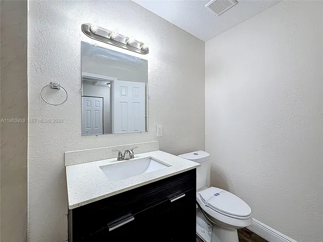 a view of a hallway with a door