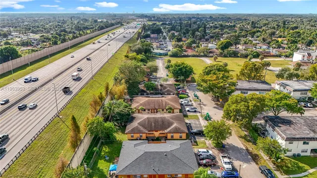 an aerial view of a house with a ocean view