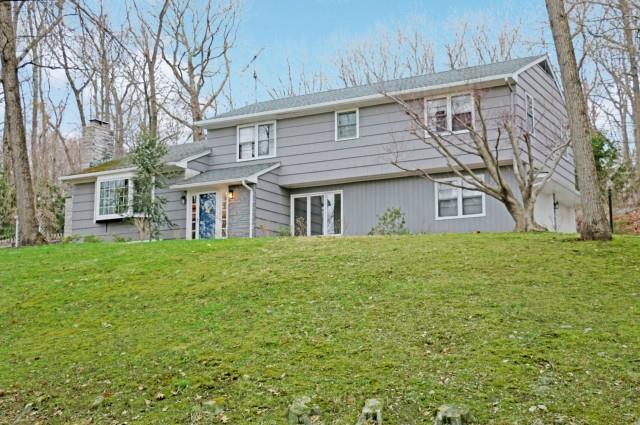 18 Wills Road Newtown, CT 06470 - Photo 1 of 1 a front view of a house with a garden