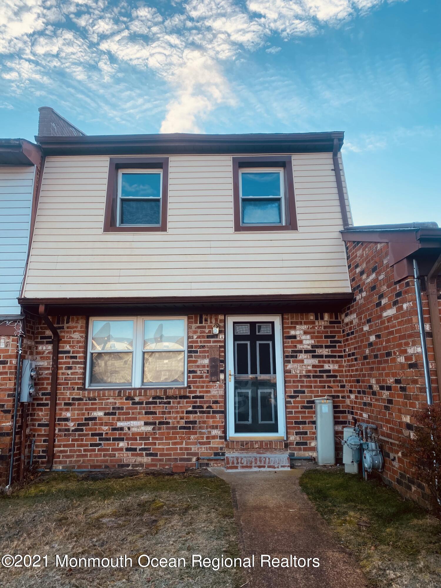 100 Greenwood Loop Road Brick, NJ 08724 - Photo 2 of 6 a front view of a house with garden