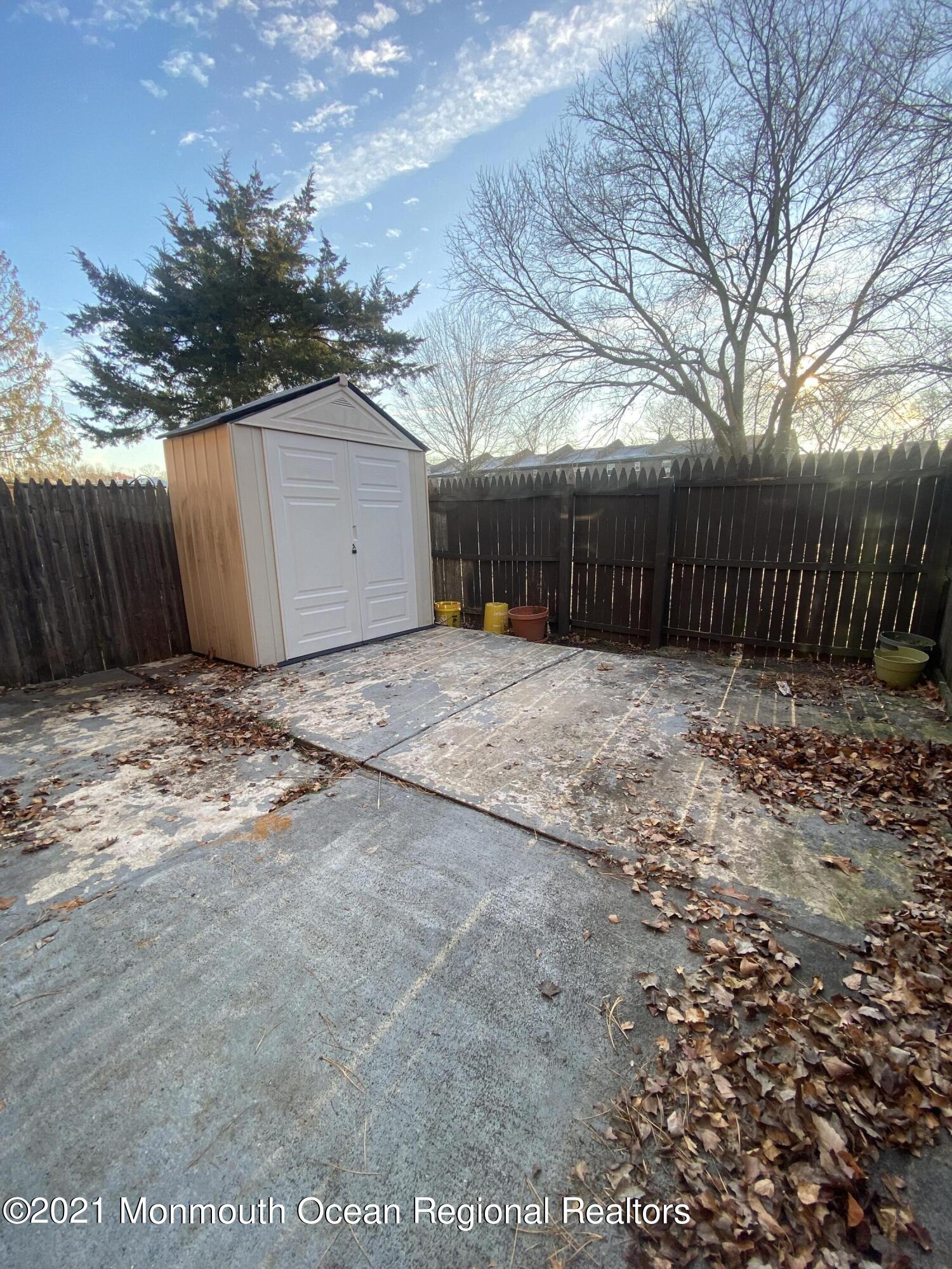 100 Greenwood Loop Road Brick, NJ 08724 - Photo 6 of 6 a view of backyard with wooden fence