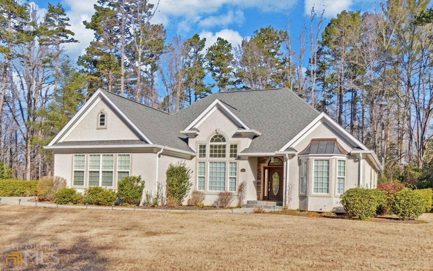 front view of a house with a yard
