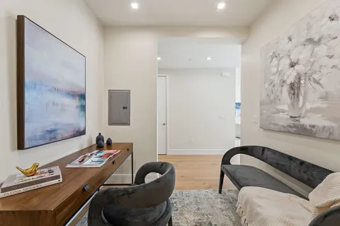 a bedroom with a bed and a couch