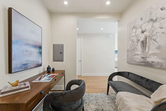 a bedroom with a bed and a couch