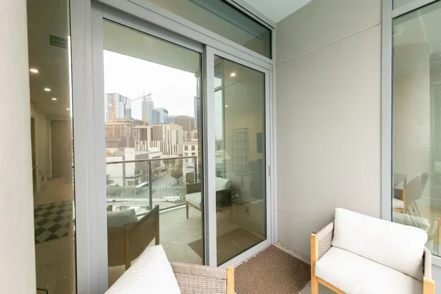 a bathroom with a glass shower door