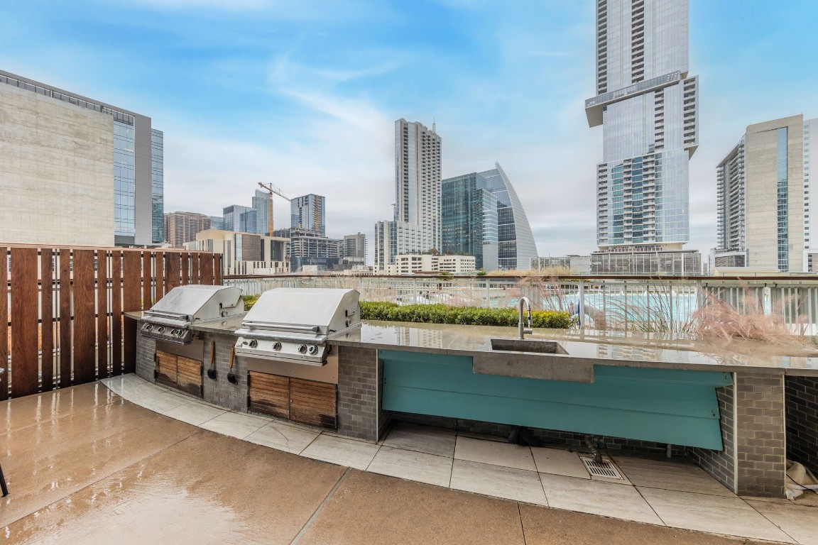 501 West Avenue, Unit 705 Austin, TX 78701 - Photo 18 of 33 a kitchen with a sink and a stove