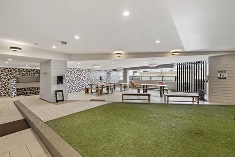 a room with lots of table and chairs